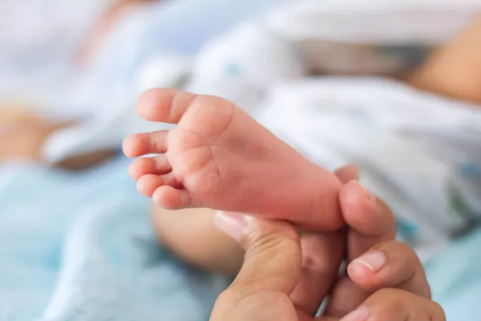 examining a neonatal patient